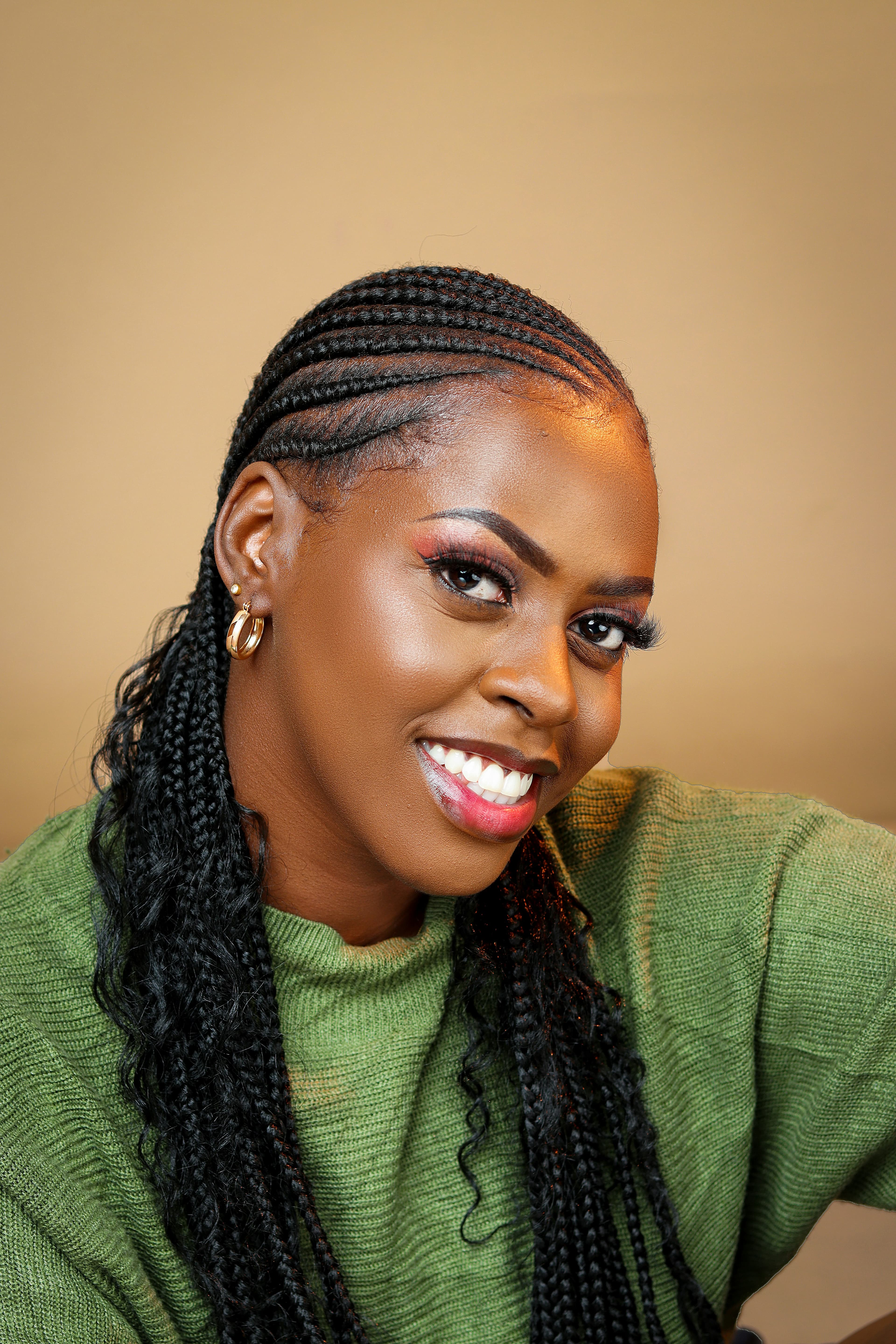 A Braida stylist finishing a client's natural hair